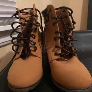 Black and brown wedge booties